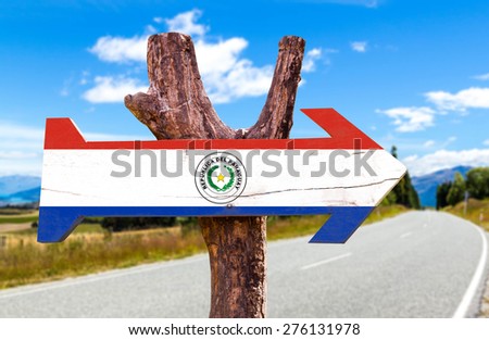 Paraguay Flag wooden sign with road background