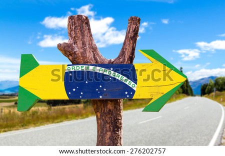 Brazil Flag wooden sign with road background