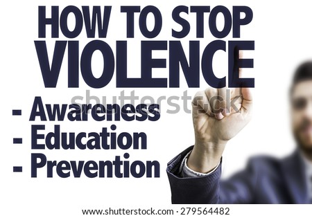 Business man pointing the text: How to Stop Violence