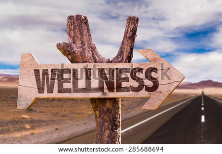 Wellness direction sign with road background