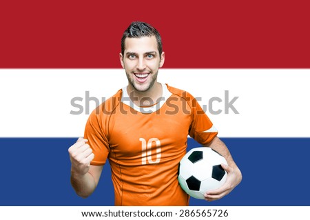 Dutch fan celebrates on Netherlands flag background