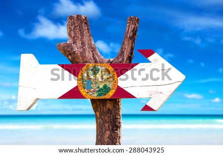 Florida Flag wooden sign with beach background