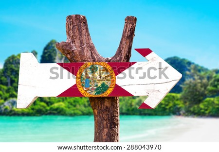 Florida Flag wooden sign with beach background