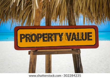 Property Value sign with beach background