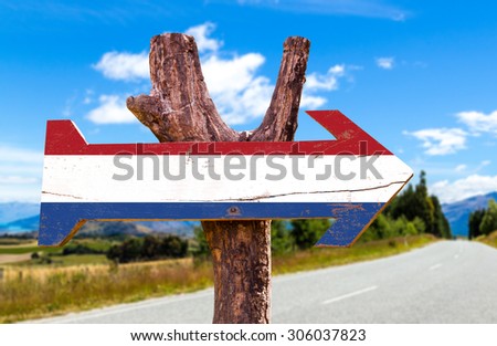 Netherlands Flag wooden sign with road background