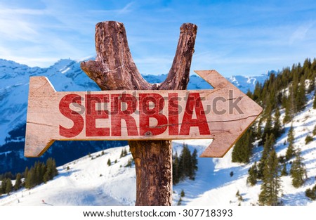 Serbia wooden sign with winter background