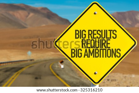Big Results Require Big Ambitions sign on desert road