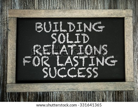 Building Solid Relations For Lasting Success written on chalkboard