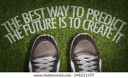 Top View of Sneakers on the grass with the text: The Best Way to Predict the Future is to Create It