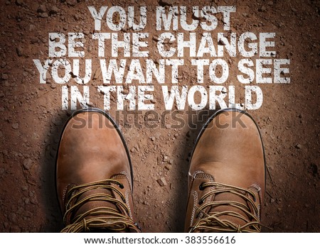 Top View of Boot on the trail with the text: You Must Be The Change You Want To See In The World
