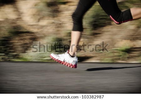 action motion blur running feet on road, healthy fitness sprint training