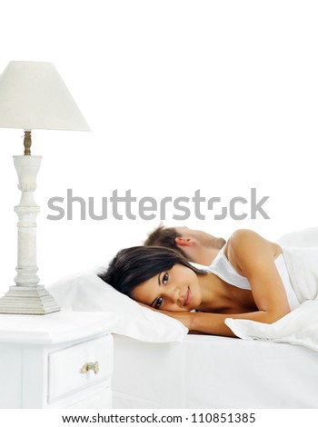 couple in bed facing away from each other after argument. relationship issues