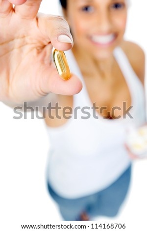 Healthy heart woman with omega 3 capsule to show a balanced diet and good cardiovascular health
