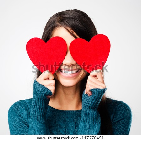adorable girl with valentines day heart showing love fun affection portrait on grey background adorable girl with valentines day heart showing love fun affection portrait on grey background