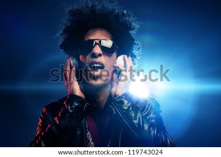 Singing dj with headphones in nightclub party scene and afro, lighting lens flare