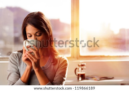 Woman Enjoys Fresh Coffee In The Morning With Sunrise At Home Lifestyle