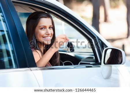 happy learner driver young girl smiling portrait with car keys