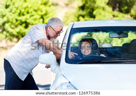 driving instructor teaching student learner driver
