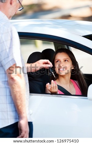 Student driver passes exam and instructor passes her keys