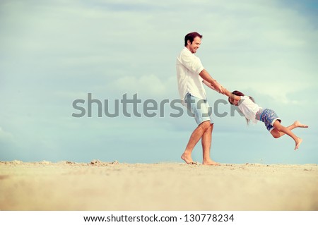 Healthy Father And Daughter Playing Together At The Beach Carefree Happy Fun Smiling Lifestyle
