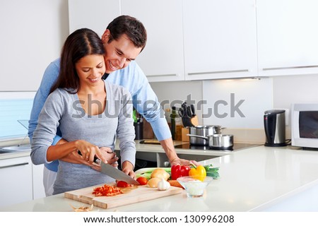 couple cooking healthy food in kitchen lifestyle meal preparation
