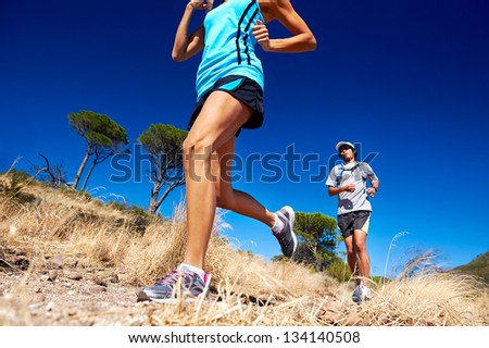 marathon running athletes couple training on trail fitness sport active lifestyle