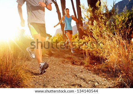Trail Running Marathon Athlete Outdoors Sunrise Couple Training For Fitness And Healthy Lifestyle