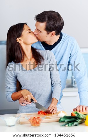 couple prepare food together in kitchen. healthy lifestyle relationship