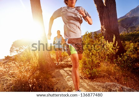 Trail Running Marathon Athlete Outdoors Sunrise Couple Training For Fitness And Healthy Lifestyle