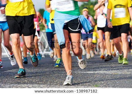 Marathon Running Race People Competing In Fitness And Healthy Active Lifestyle Feet On Road