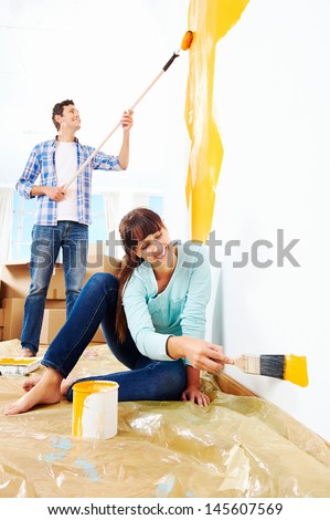 renovation diy paint couple in new home painting wall
