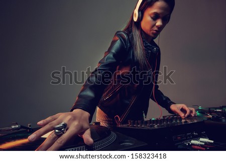 real woman dj playing music at party