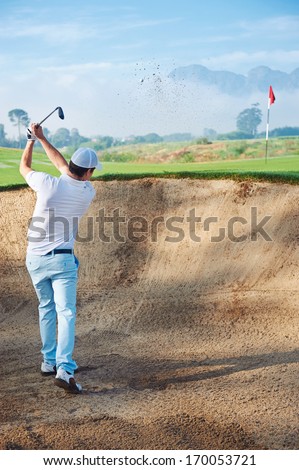 golf shot from sand bunker golfer hitting ball from hazard