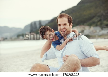 Father And Son Playing At Beach Together Portrait Fun Happy Lifestyle