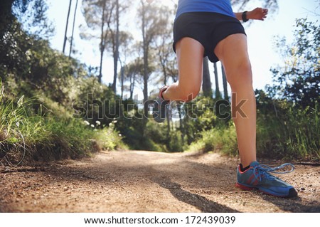 Low Angle View Of Trail Runner Exercising For Marathon