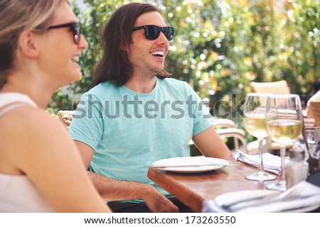 Couple drinking white wine at lunch while on summer vacation