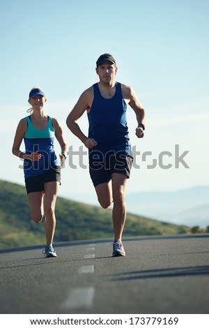 fitness exercising couple training for marathon running lifestyle
