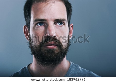 Portrait of real hipster man with full beard