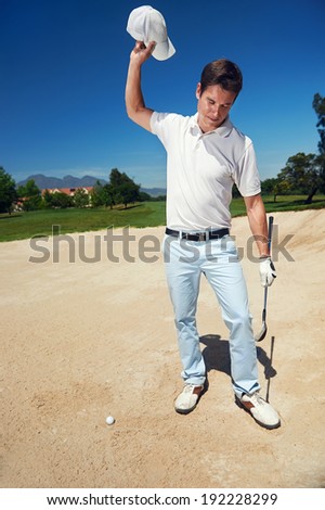 Golfer golf man having meltdown in bunker frustration