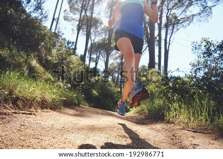 low angle view of trail runner exercising for marathon