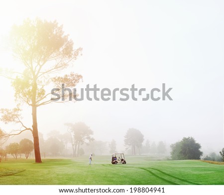 Beautiful early morning golf game at the course in the sunrise and panoramic view