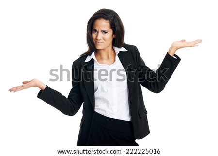 woman confused in business and shrugs her shoulders