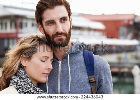 portrait of couple with woman sleeping on man shoulder