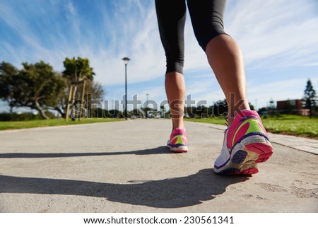 runner feet marathon training on road workout for fitness