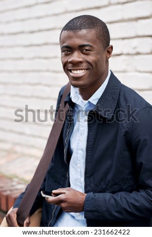 Portrait of happy black african man in urban environment
