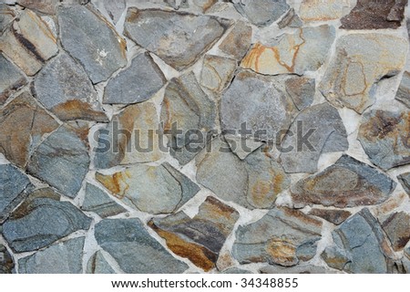 cement and stone bond together to form a wall