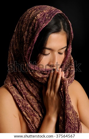 Asian girl prays
