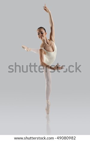 Professional female ballet dancer isolated in studio