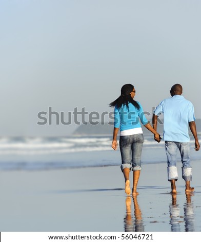 stock photo : Happy couple walking on the beach in summer