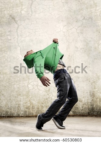Hip hop dancer pulls himself off the floor